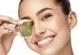 Eye Skin Care. Beautiful Woman With Green Tea Bag Under Eyes Royalty Free Stock Photo