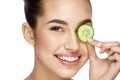 Eye Skin Care. Woman With Natural Makeup Using Cucumber Royalty Free Stock Photo