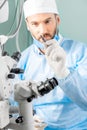 Eye surgeon with surgical scissors Royalty Free Stock Photo