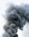 Eye view of vintage antenna in front of fire burning smoke in ea