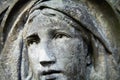 Eye view of Virgin Mary. Very ancient stone statue, fragment. Pain, faith, hope, Christian values concept Royalty Free Stock Photo