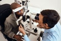 Eye, vision or sight test or exam of a patient above at an optometrist, optician or ophthalmologist. Testing and Royalty Free Stock Photo