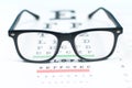 Eye vision test chart seen through eye glasses.