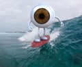 Eyeball with arms and legs surfing on the sea