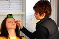 Eyebrow plucking at a beauty salon