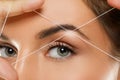 Eyebrow threading - epilation procedure for brow shape correction