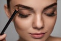 Eyebrows Contouring. Beautiful Woman With Brown Eyebrow Pencil Royalty Free Stock Photo