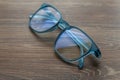 Eyeglassed blue color on wooden table office Royalty Free Stock Photo