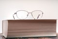 Eyeglasses with bifocal lenses on book Royalty Free Stock Photo