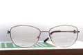 Eyeglasses with bifocal lenses on a book Royalty Free Stock Photo