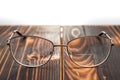 Eyeglasses with bifocals lenses on wooden board