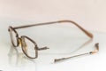 Eyeglasses with a broken handle Royalty Free Stock Photo