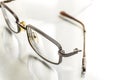 Eyeglasses with a broken shackle on a bright background Royalty Free Stock Photo