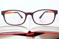 Eyeglasses closeup with book