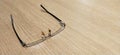 Eyeglasses closeup on plywood table Royalty Free Stock Photo