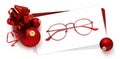 Eyeglasses gift card, red spectacles and red christmas balls with ribbon bow, isolated on white background Royalty Free Stock Photo