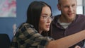 Eyeglasses girl gesturing at video call remote workplace. Students brainstorming