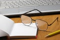 Eyeglasses,laptop and notebook. Royalty Free Stock Photo