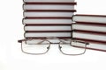 Eyeglasses laying about books Royalty Free Stock Photo