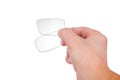 Eyeglasses lenses in man`s hand on white background