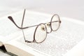 Eyeglasses on open book Royalty Free Stock Photo