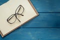 Eyeglasses on opened notebook Royalty Free Stock Photo