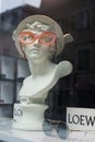 Eyeglasses presentaion on statue by Loewe in optician  store showroom Royalty Free Stock Photo