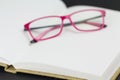 Eyeglasses resting on blank pages Royalty Free Stock Photo