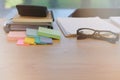 eyeglasses sticky note notebook on office workplace desk. business workspace Royalty Free Stock Photo