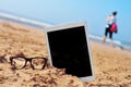 Eyeglasses and tablet with black blank space in the screen, in t