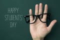 Eyeglasses and text happy students day