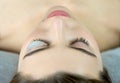 Close up of beauty model`s face with perfect fresh skin and long eyelashes, lash lift laminate botox procedure