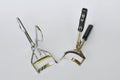 Eyelash curler with silver and black handle on white background Royalty Free Stock Photo