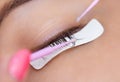 Eyelash removal procedure close up. Beautiful Woman with long lashes in a beauty salon. Royalty Free Stock Photo