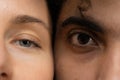 Eyes of Arabic man and white woman looking in camera macro Royalty Free Stock Photo