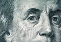 Eyes of Benjamin Franklin on a hundred dollar bill.