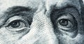 Eyes of Benjamin Franklin on one hundred dollars banknote Royalty Free Stock Photo