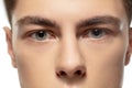Close up face of young man isolated on white studio background. Caucasian attractive male model. Concept of fashion and Royalty Free Stock Photo
