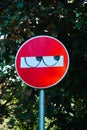 Eyes drawn with a marker on a traffic sign for a prohibited direction. Graffiti, street art, fun Royalty Free Stock Photo