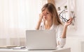 Frustrated Businesswoman Massaging Nosebridge Sitting At Workplace Royalty Free Stock Photo