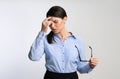 Overworked Businesswoman Massaging Nosebridge Having Ocular Hypertension Over White Background Royalty Free Stock Photo