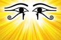 Eyes of Horus with golden sunbeams