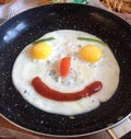 Fried eggs smithery-smiling face in the frying pan