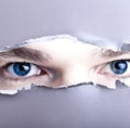 Eyes looking through gap Royalty Free Stock Photo