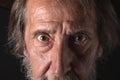 Eyes of an old bearded man, looking at the camera Royalty Free Stock Photo