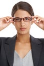 Eyes on the prize. Portrait of an attractive young businesswoman wearing glasses isolated on white. Royalty Free Stock Photo