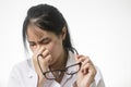 Young woman feeling discomfort because of wearing short sighted glasses, suffering from eyes p Royalty Free Stock Photo