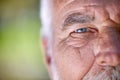 Eyes, vision and old man, face closeup and wisdom with focus, insight and thinking with mockup space. Elderly male