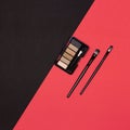 Eyeshadow palette with makeup brushes. Top view, flat lay. Eye makeup essentials