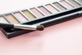 Eyeshadow pallete kit against pink background, copy space Royalty Free Stock Photo